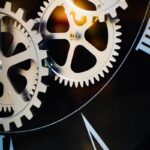 Close-up of intricate clockwork gears and roman numerals